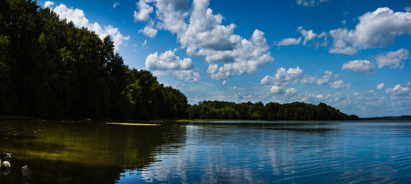 Panoramic Lake Champlain landscape, cloudscape, Mount Independence forest, and water reflection in Ticonderoga, New York, USA