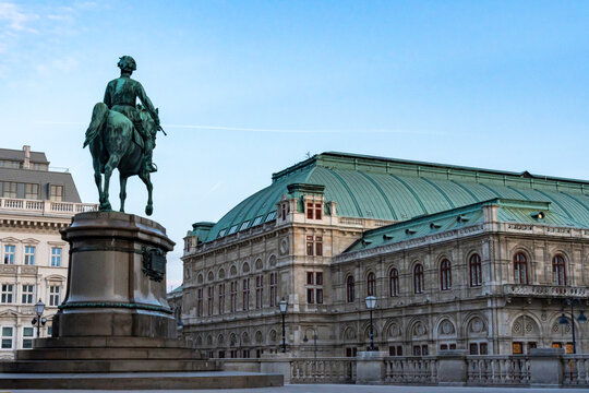 Equestrian Statue Before Historic Building with Green Roof