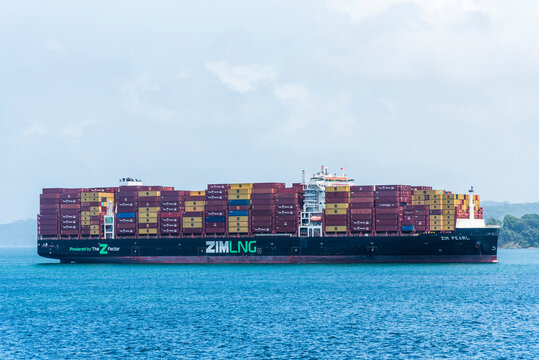 LNG-powered container ship ZIM Pearl anchored outside the Agua Clara Locks awaiting transit through the Panama Canal.