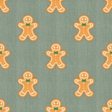 Cute knitted gingerbread man seamless pattern on green fabric linen background. Cozy Christmas winter pattern for holiday tablecloth, wrapping paper, textile, fabric print, and wallpaper.