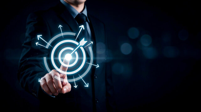 Businessman Touching Digital Target Icon to Achieve Marketing Success and Strategic Growth Goals on Dark Background