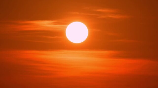 Peaceful sunset time-lapse with warm golden light and fast-moving clouds.
