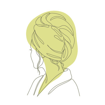 Woman with hair wrapped in towel after bath.
