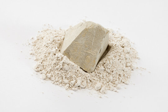 Still Life of Off-White Layered Soil Chunk and Pale Soil Powder
