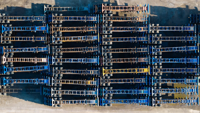 Stacking empty container chassis for logistics and transport