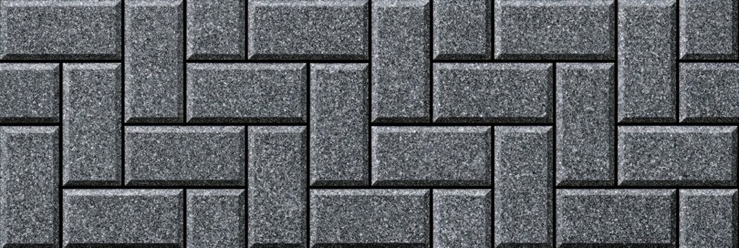 Dark gray textured interlocking pavers arranged in a repeating herringbone pattern