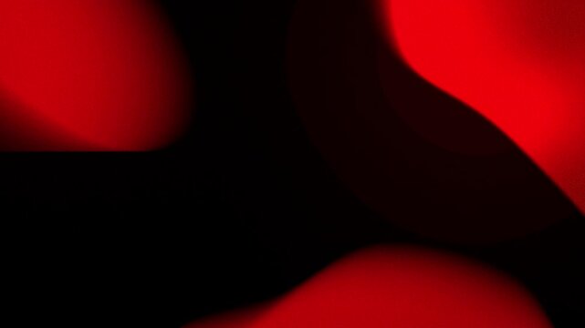 Abstract red blurred light orbs floating in dark space soft circular drifting