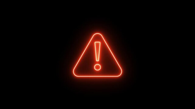 Red neon warning sign with exclamation mark on a dark background, conveying caution and alert.
