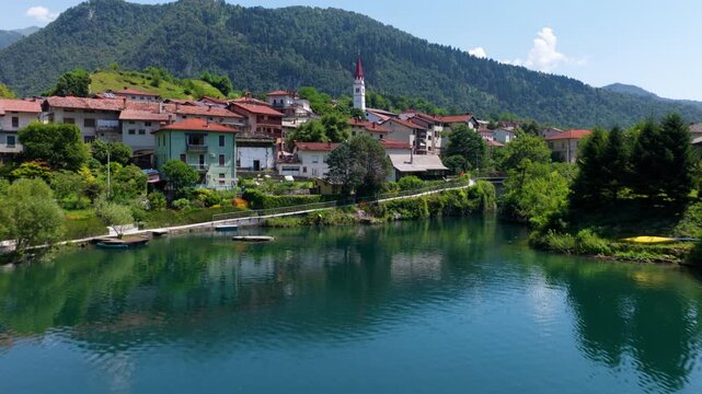 Most na Soči Town Along The Vibrant Turquoise Reservoir In Western Slovenia. Aerial Drone Shot