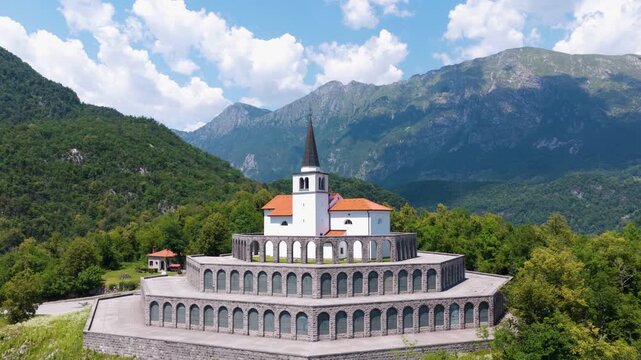 View Of The 17th-century Church Of St. Anthony In Kobarid, Slovenia. Historic Church And Traditional Architecture. Aerial Rotate Shot