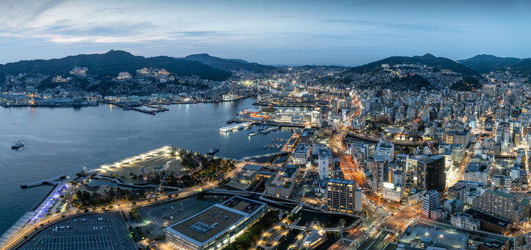 Aerial view of the city skyline at night in Nagasaki, Japan, a bay city.