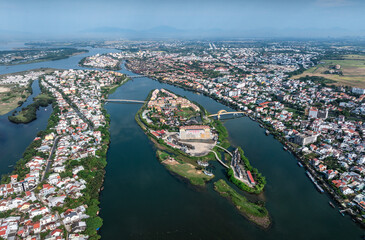 Fototapeta premium Aerial view of the ancient city of Hoi An and the Thu Bon River in Vietnam