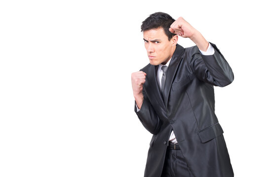 Serious worker standing in boxing stance and clenching fists