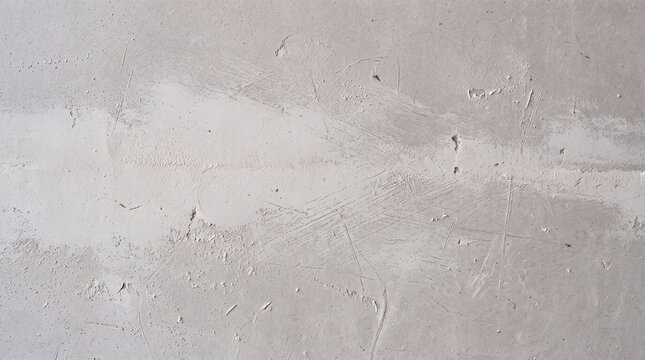 Freshly sanded joint compound feathered smooth across a drywall surface