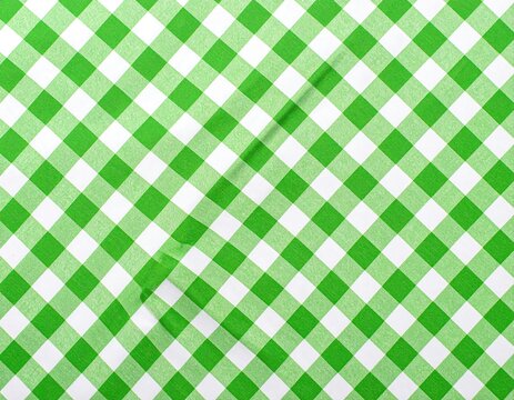 A close-up shot of a gingham pattern in green and white, a classic design for various backgrounds
