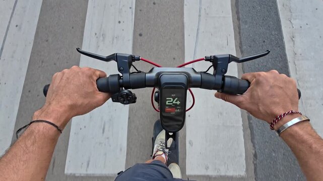 POV Shot Of A Person Riding An Electric Scooter On An Urban Street Emphasizing Safety Hazards And Traffic Risks In A Busy City Environment