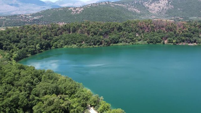 Lake Ziros in Epirus Greece, Hidden Forest Lake with Blue-Green Waters, Aerial Wide Shot Panorama