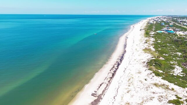 Panoramic drone fly at the Gulf of Mexico tropical environment with Cape San Blas beach and distant St. Joseph Bay narrow peninsula coastline area, Florida, US