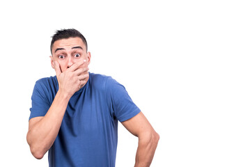 Obraz premium Man covering his mouth with a surprised expression