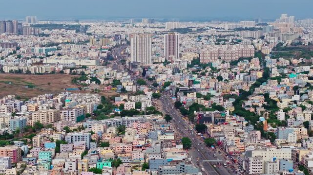 Aerial view of chanda nagar Residential buildings with national highway 65 and traffic flow at hyderabad, telangana, india. day time, static shot, drone shot, 4k.