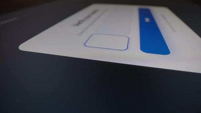 Motorized moving shot of entering two-factor authentication code for secure identity verification
