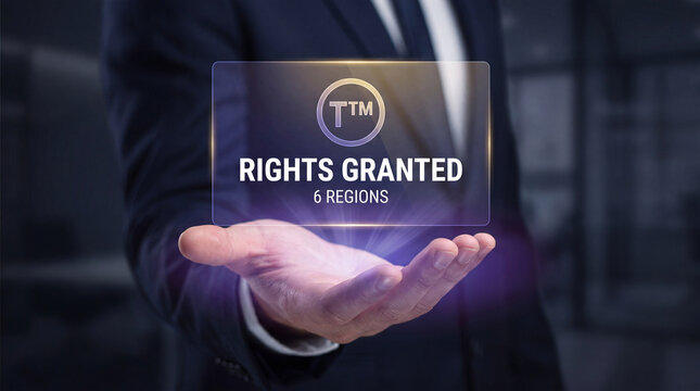 businessman holds glowing brand licensing interface above open palm to verify royalty rate agreement, track territory usage rights, confirm trademark approval stage, and support intellectual property