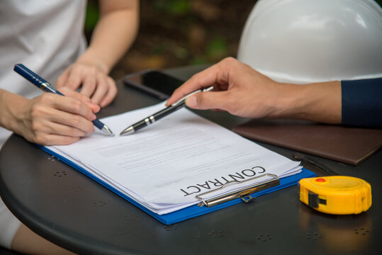 Engineer man Contractor brainstorming teams partner meeting together in office desk. Paint palette architecture plan. Asian interior designer team partner engineer brainstorming choosing color swatch