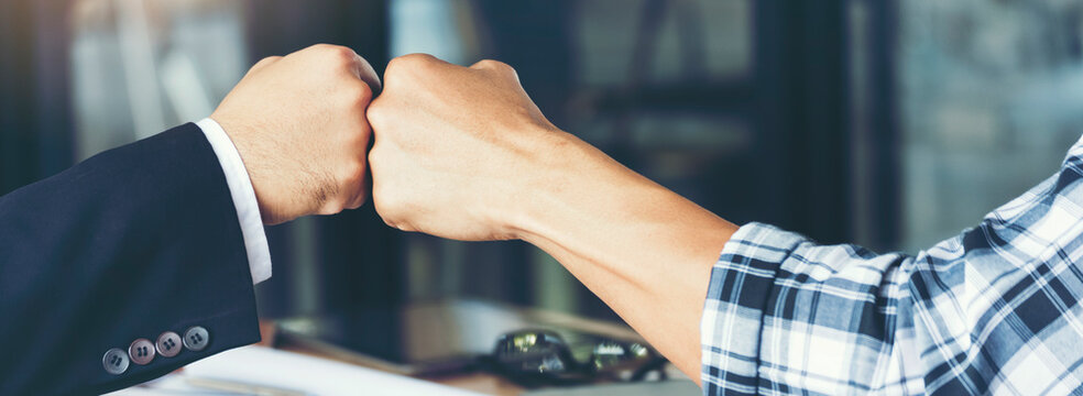 Team bump fist together Banner diversity solidarity teams multiethnic Partners hands together teamwork. Group of multiracial fist bump hands stack join hands together. Volunteer mission business