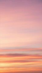 Fototapeta premium Pastel Sunset Sky: A serene and breathtaking view of a sunset sky painted with soft pastel hues of pink, orange, and lavender, creating a tranquil and dreamlike atmosphere.