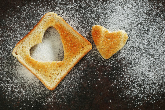 Heart shaped toast on background