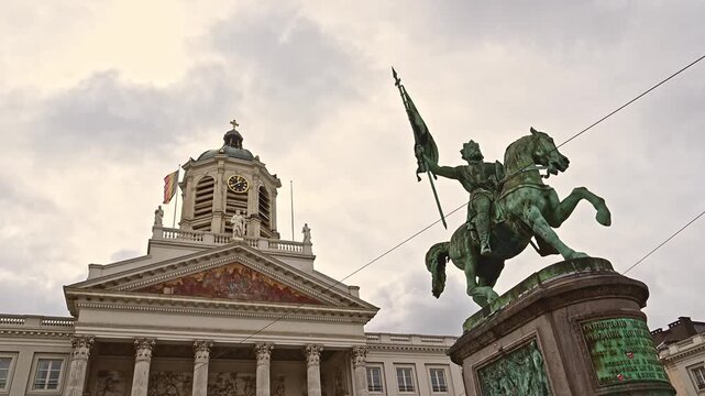Slow-motion view of Brussels' Royal Square featuring the equestrian statue of Godfrey of Bouillon and the Church of St. James on Coudenberg, Belgium.