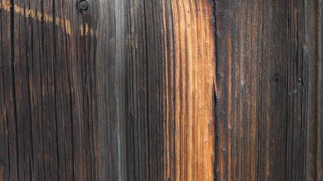 The chipboard material is stacked, a composite material made of wood with a porous edge and a multilayer structure in side lighting with a clear contour and an organic surface.