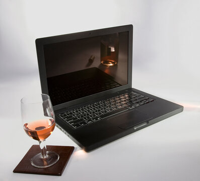 Laptop and a glass of wine 