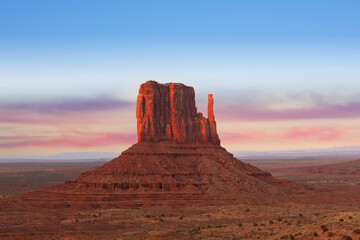 Monument Valley Butte Silhouette at Sunrise with Desert Mist and Vibrant Dawn Sky, Arizona, Utah, USA © somchaij