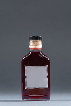bottle with homemade alcohol tincture or cognac or liquor, mockup with empty label