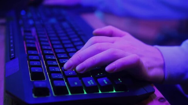 Close-Up of Gamer Hands on RGB Keyboard and Mouse During Stream