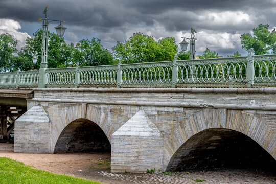 A small stone bridge with supports across the river.