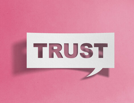 Paper speech bubble with trust text cutout on pink background, confidence and reliability concept
