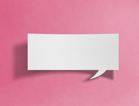 Blank rectangular paper speech bubble on pink background with copy space for message or text