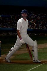 Obraz premium Full length of batsman stretching on cricket field 