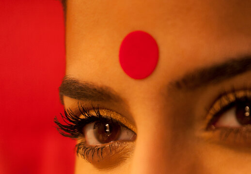 Close-up of eye and bindi of a woman 