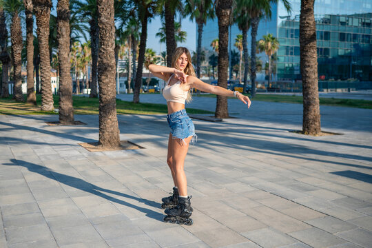 Woman rollerblading enjoying active lifestyle in city park