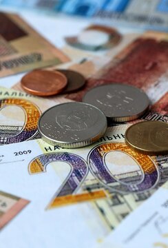 Belarusian ruble money banknotes and coins on table. Belarus cash bills of BYN currency