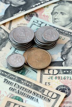 US dollar money 10 and 20 banknotes and coins on table. United States cash bills of USD currency