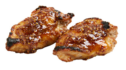 Two grilled chicken thighs with honey mustard glaze and seeds © Otillie