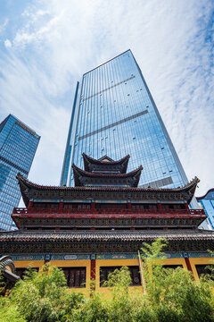 Chongqing, China - July 19, 2026: Luohan Temple, or Arhat Temple, traditional roof against modern skyscrapers, Chongqing, China