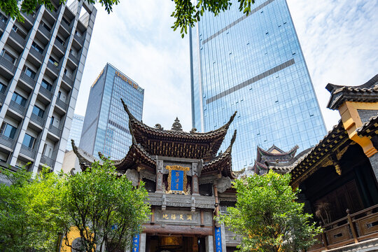 Chongqing, China - July 19, 2026: Luohan Temple, or Arhat Temple, traditional roof against modern skyscrapers, Chongqing, China