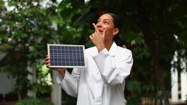 Female scientist explaining renewable solar panel energy