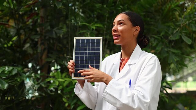 Female scientist explaining renewable solar panel energy