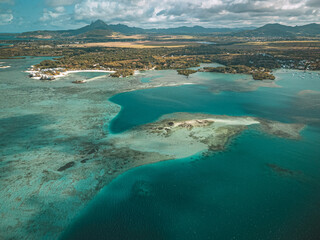 Aerial View of a Coastal Lagoon with Coral Reef and Mountain © Johann